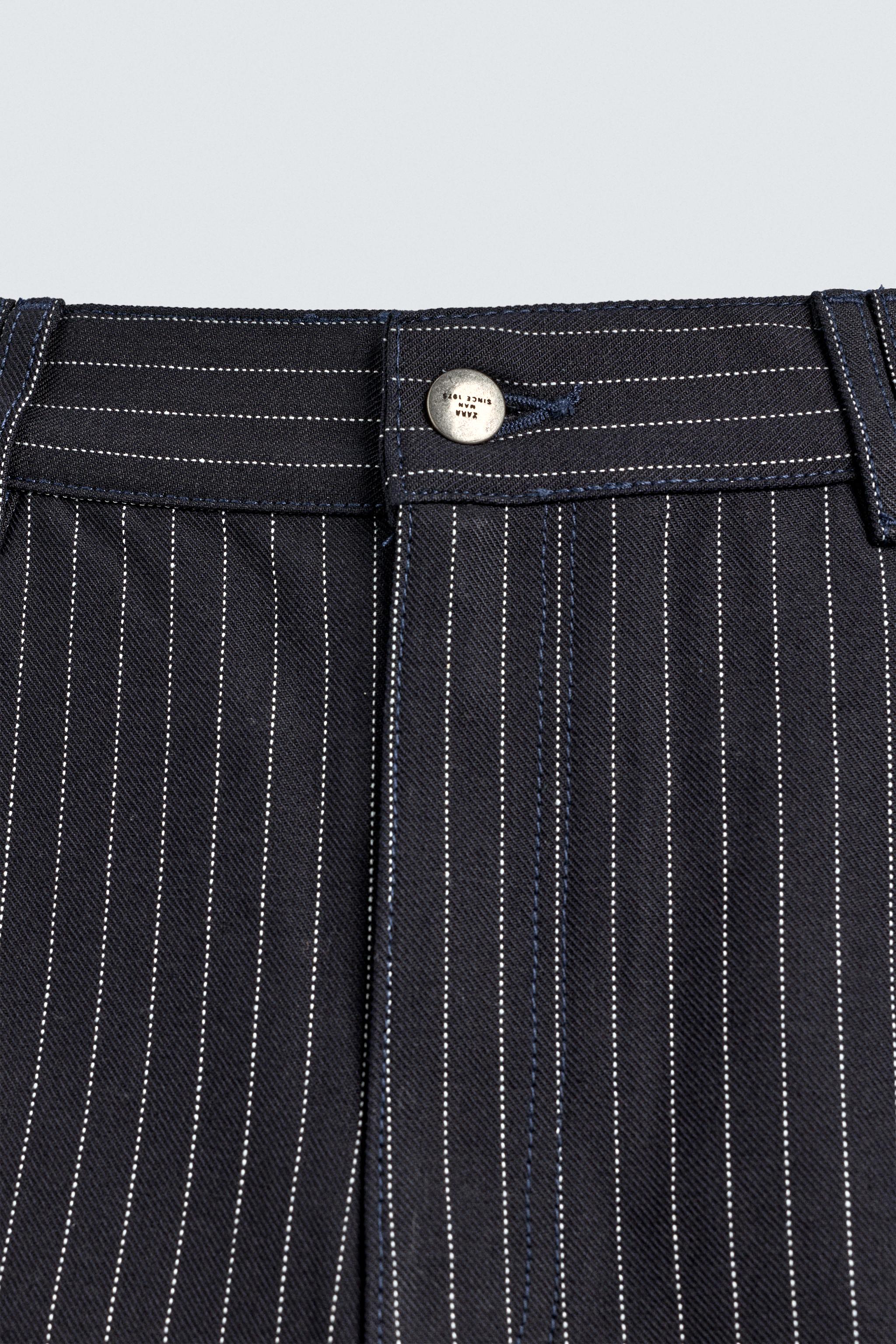 PINSTRIPED PLEATED SHORTS